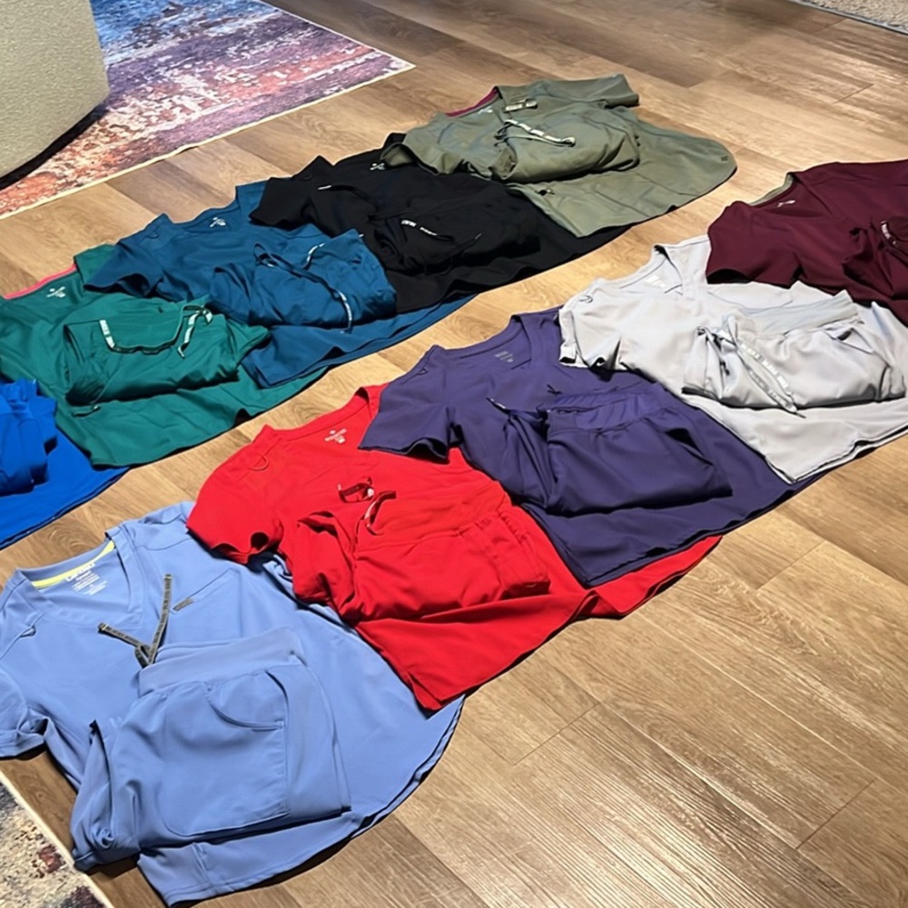 Med Couture Women's scrubs L bottoms/Med tops. 40 a set. $380 for all.